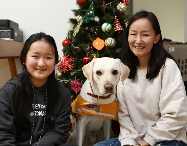 A trainee guide dog, aged 8 to 9 weeks, is living with a volunteer family participating in puppy walking.